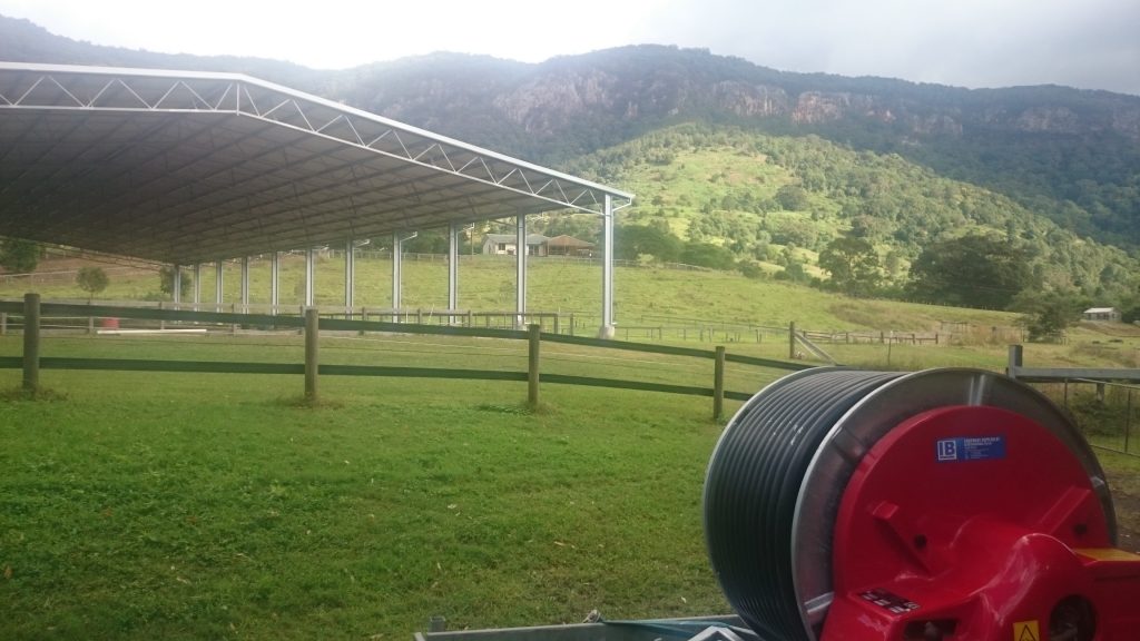 Ocmis MR40:130 Hard Hose Irrigator to be installed to water the undercover horse arena in the background - Natural Bridge, Qld